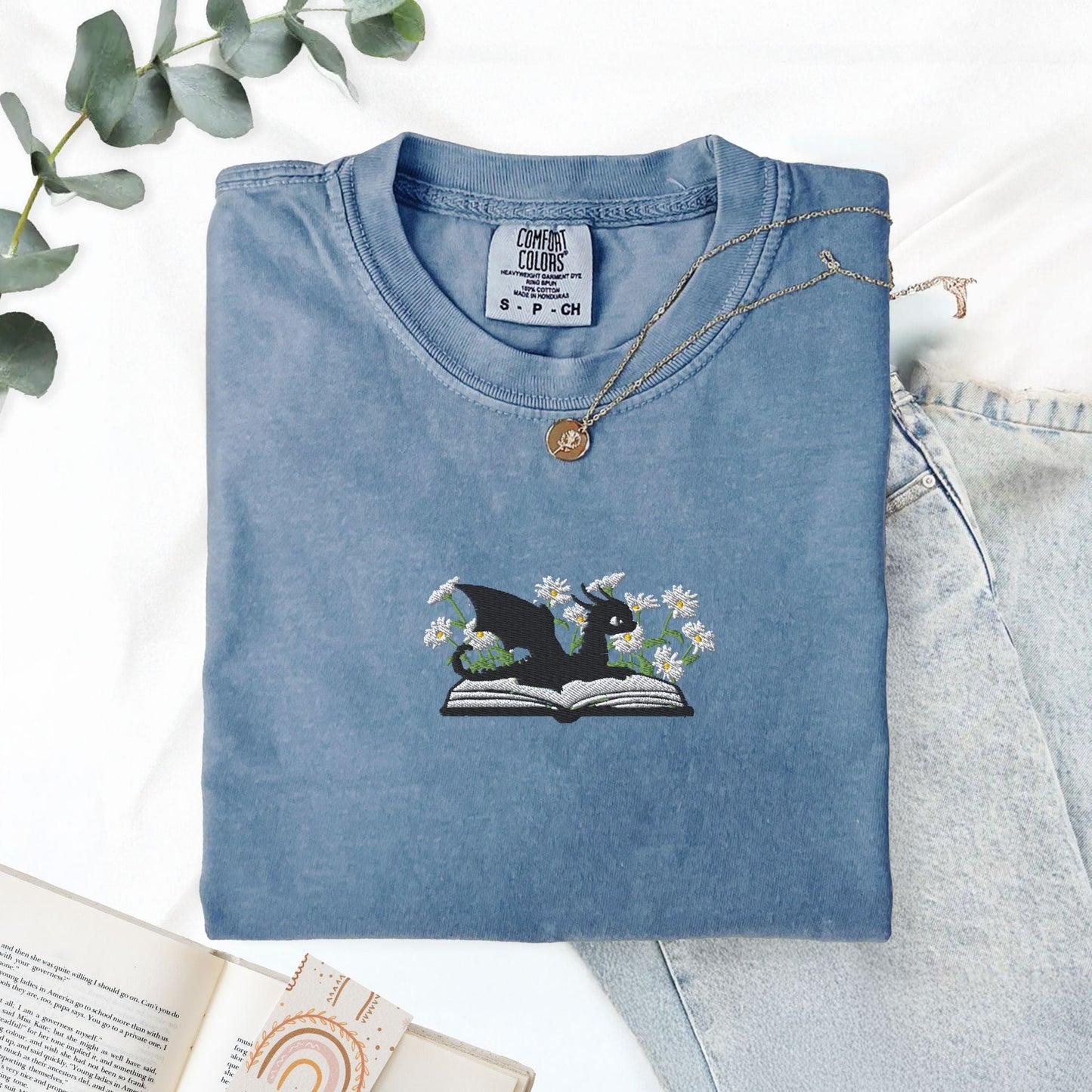 Pine Spice Books Embroidered Dragon and Book with Daisies T-Shirt Embroidered Dragon and Book with Daisies T-Shirt