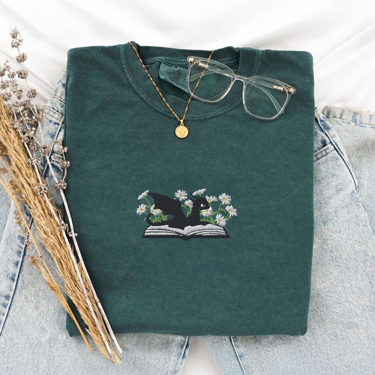 Pine Spice Books Embroidered Dragon and Book with Daisies T-Shirt Embroidered Dragon and Book with Daisies T-Shirt