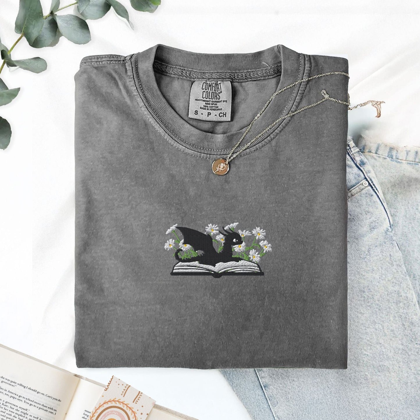 Pine Spice Books Embroidered Dragon and Book with Daisies T-Shirt Embroidered Dragon and Book with Daisies T-Shirt