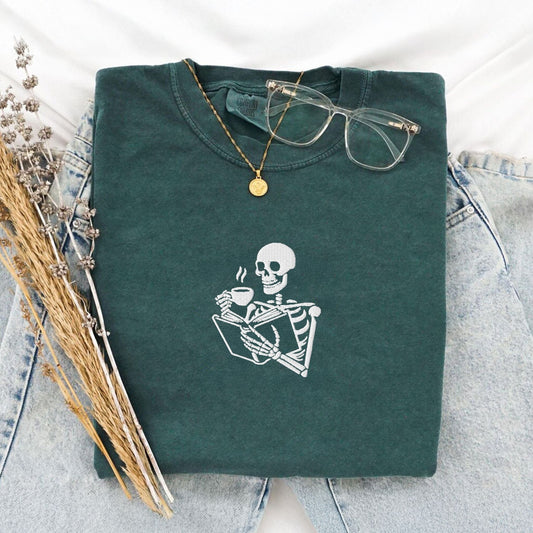 My Store Embroidered Skeleton Reading a Book Spooky Cute T-Shirt Embroidered Skeleton Reading a Book Spooky Cute T-Shirt