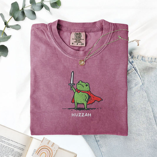 Pine Spice Books Huzzah Frog Embroidered T-Shirt – Comfort Colors 1717 Huzzah Frog Embroidered T-Shirt – Comfort Colors 1717