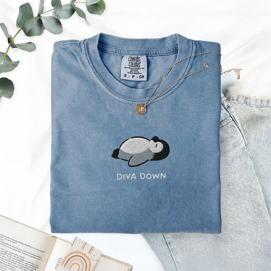 Pine Spice Books Diva Down Penguin Embroidered T-Shirt Diva Down Penguin Embroidered T-Shirt