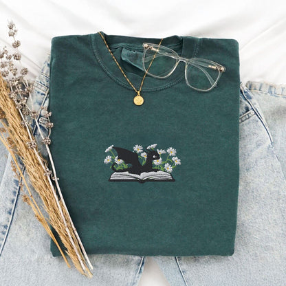 Pine Spice Books Embroidered Dragon and Book with Daisies T-Shirt Embroidered Dragon and Book with Daisies T-Shirt