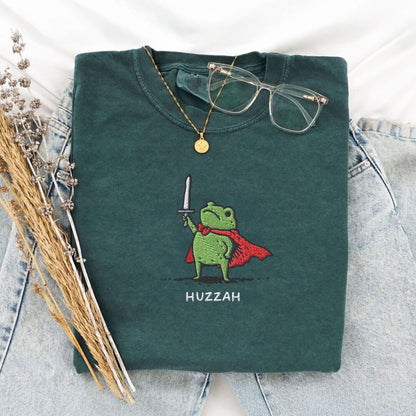 Pine Spice Books Huzzah Frog Embroidered T-Shirt – Comfort Colors 1717 Huzzah Frog Embroidered T-Shirt – Comfort Colors 1717