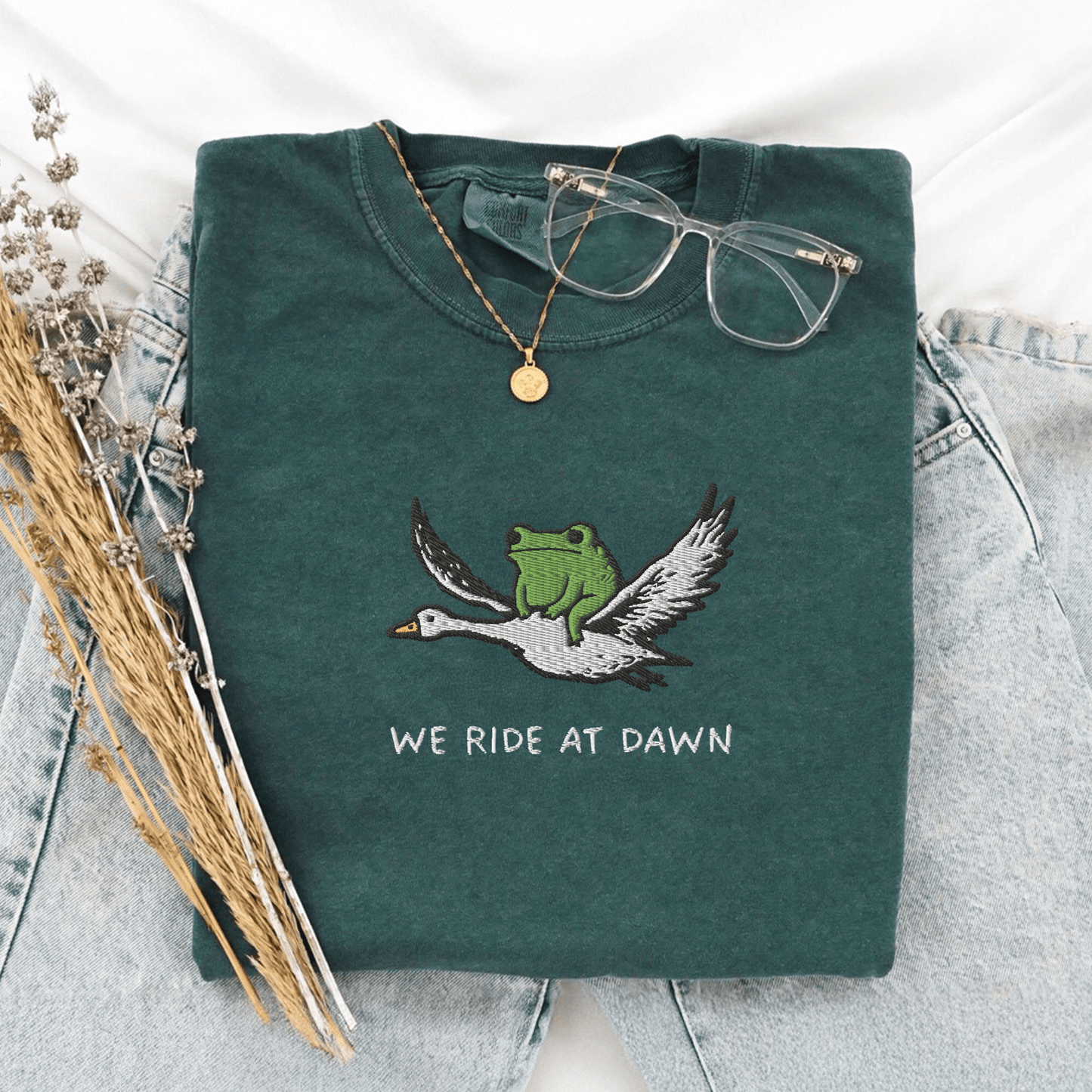 Pine Spice Books We Ride At Dawn Frog Goose Embroidered T-Shirt We Ride At Dawn Frog Goose Embroidered T-Shirt