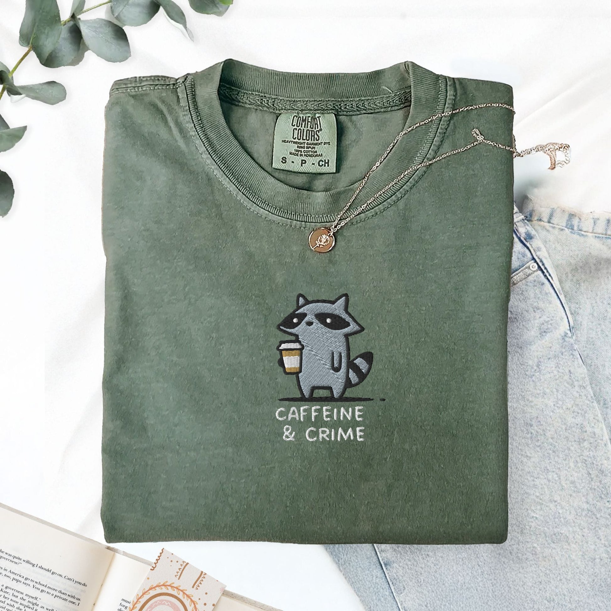 Pine Spice Books Caffeine And Crime Embroidered Raccoon T-Shirt Caffeine And Crime Embroidered Raccoon T-Shirt