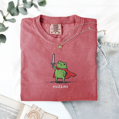 Pine Spice Books Huzzah Frog Embroidered T-Shirt – Comfort Colors 1717 Huzzah Frog Embroidered T-Shirt – Comfort Colors 1717