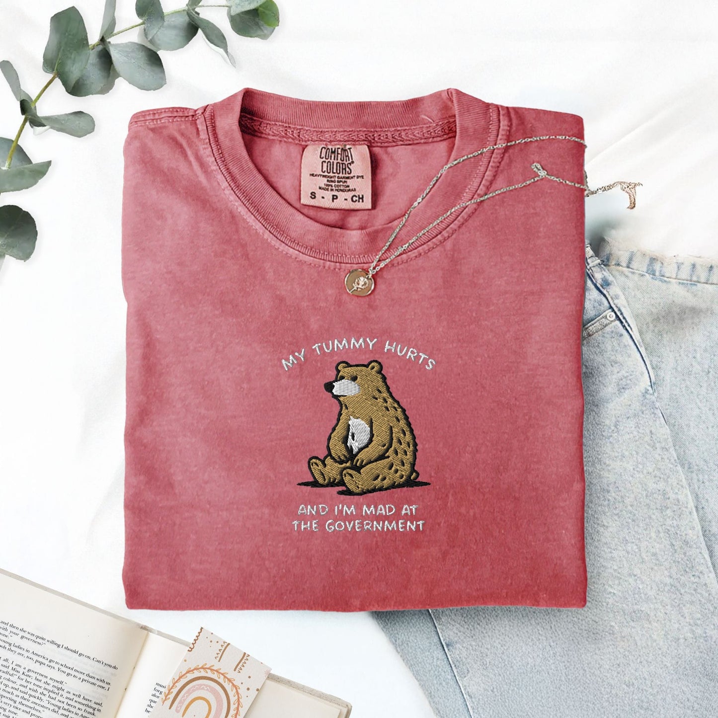 Pine Spice Books Tummy Hurts Embroidered T-Shirt Tummy Hurts Embroidered T-Shirt