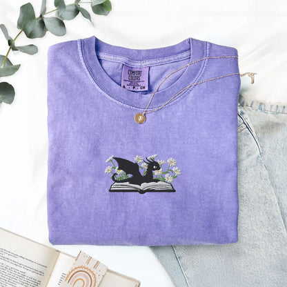 Pine Spice Books Embroidered Dragon and Book with Daisies T-Shirt Embroidered Dragon and Book with Daisies T-Shirt