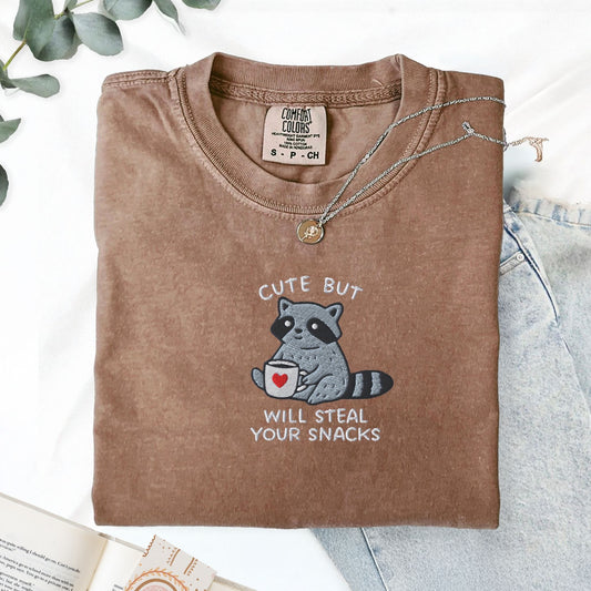Pine Spice Books Cute But Will Steal Your Snacks Raccoon Embroidered T-Shirt Cute But Will Steal Your Snacks Raccoon Embroidered T-Shirt