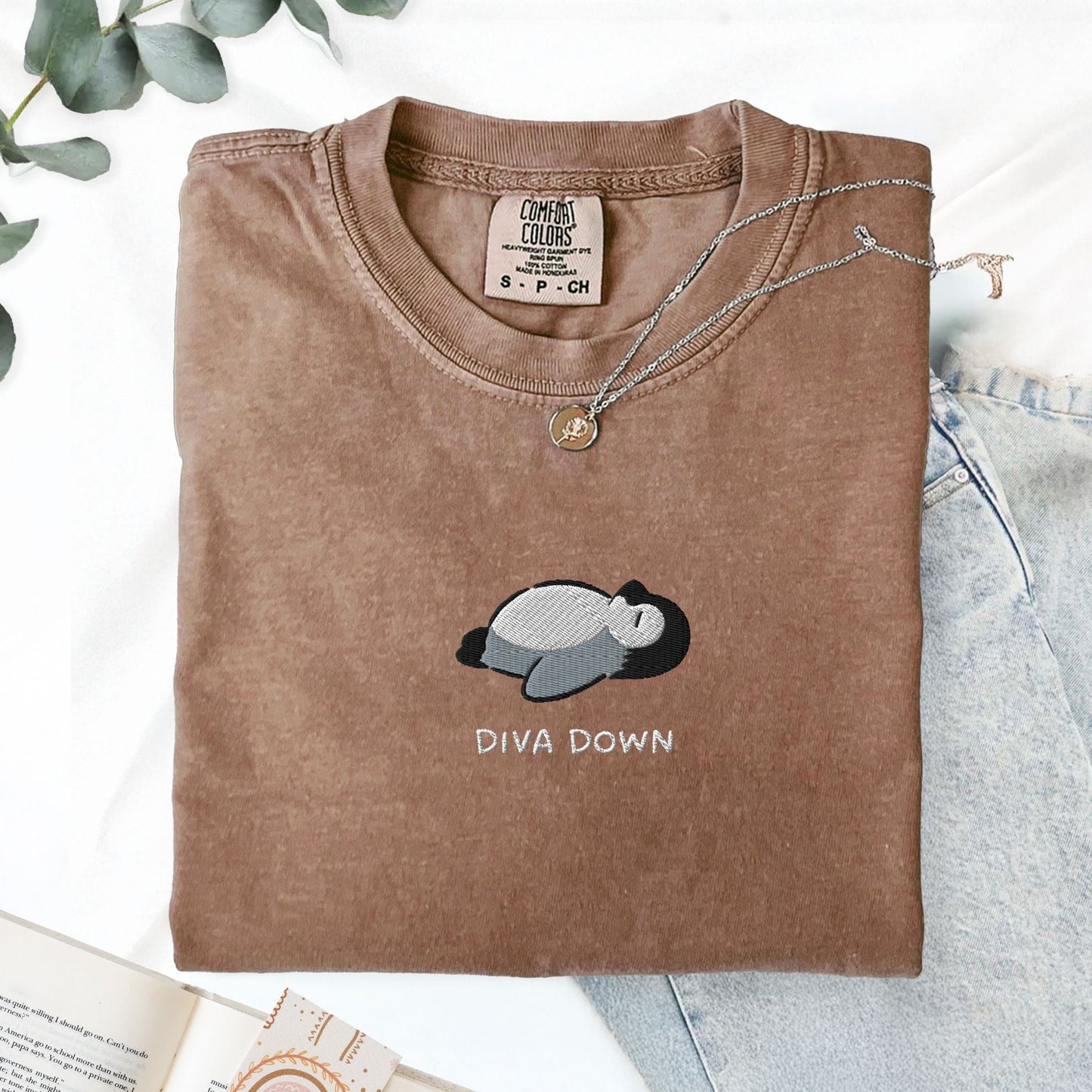 Pine Spice Books Diva Down Penguin Embroidered T-Shirt Diva Down Penguin Embroidered T-Shirt