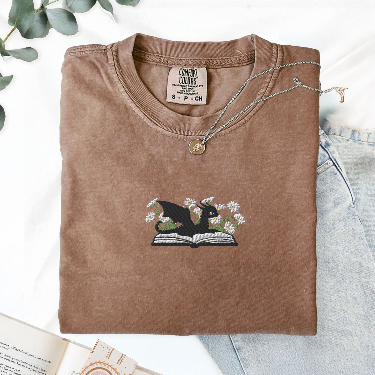 Pine Spice Books Embroidered Dragon and Book with Daisies T-Shirt Embroidered Dragon and Book with Daisies T-Shirt