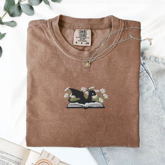 Pine Spice Books Embroidered Dragon and Book with Daisies T-Shirt Embroidered Dragon and Book with Daisies T-Shirt