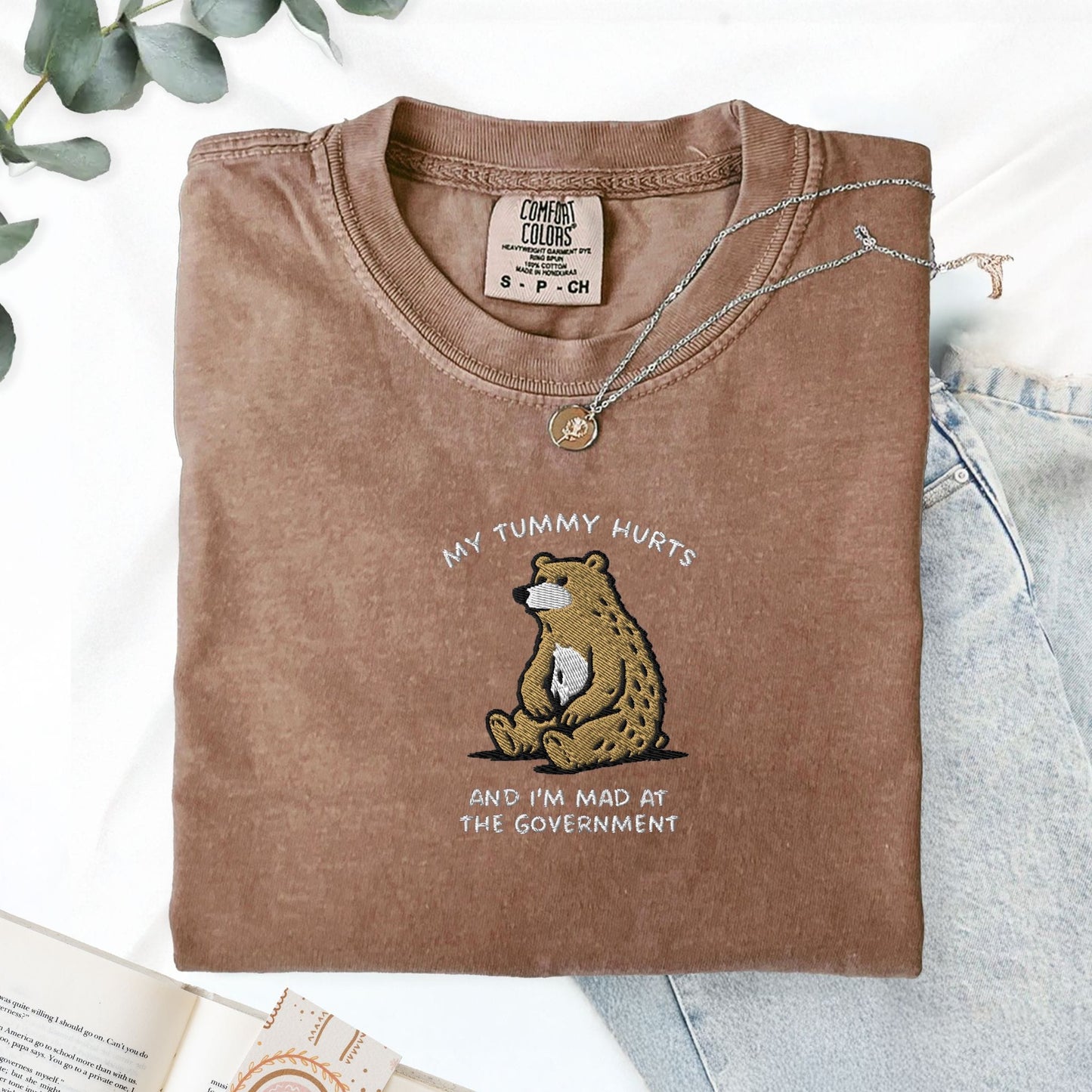 Pine Spice Books Tummy Hurts Embroidered T-Shirt Tummy Hurts Embroidered T-Shirt