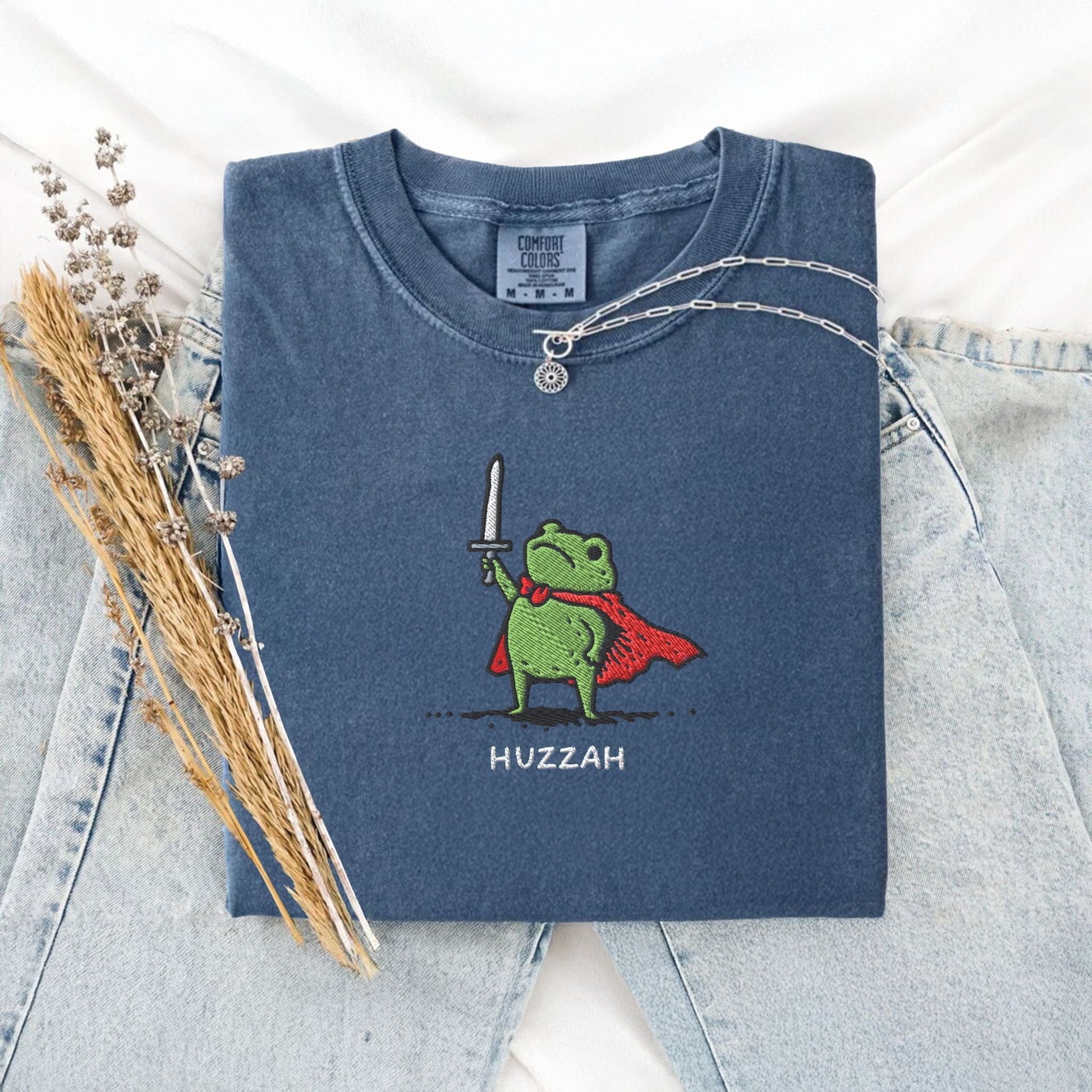 Pine Spice Books Huzzah Frog Embroidered T-Shirt – Comfort Colors 1717 Huzzah Frog Embroidered T-Shirt – Comfort Colors 1717