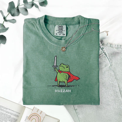 Pine Spice Books Huzzah Frog Embroidered T-Shirt – Comfort Colors 1717 Huzzah Frog Embroidered T-Shirt – Comfort Colors 1717