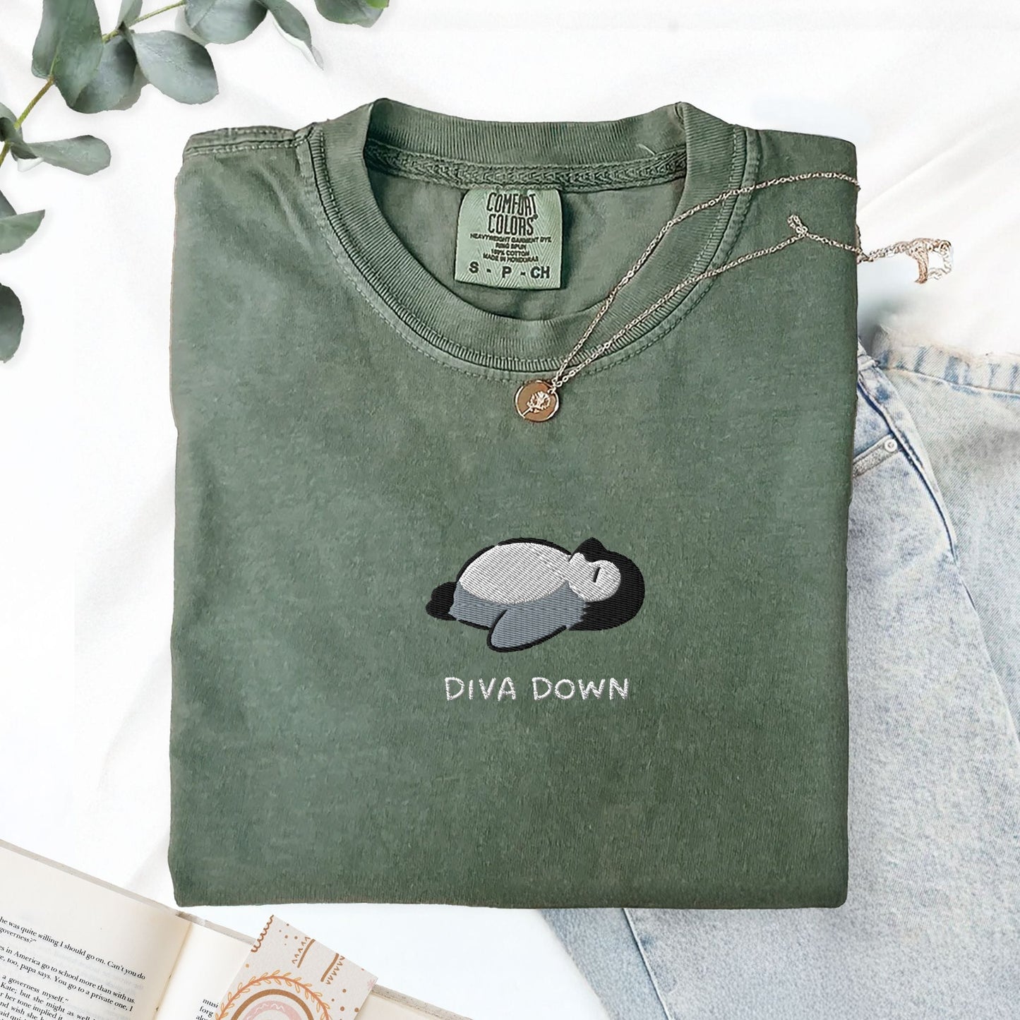 Pine Spice Books Diva Down Penguin Embroidered T-Shirt Diva Down Penguin Embroidered T-Shirt