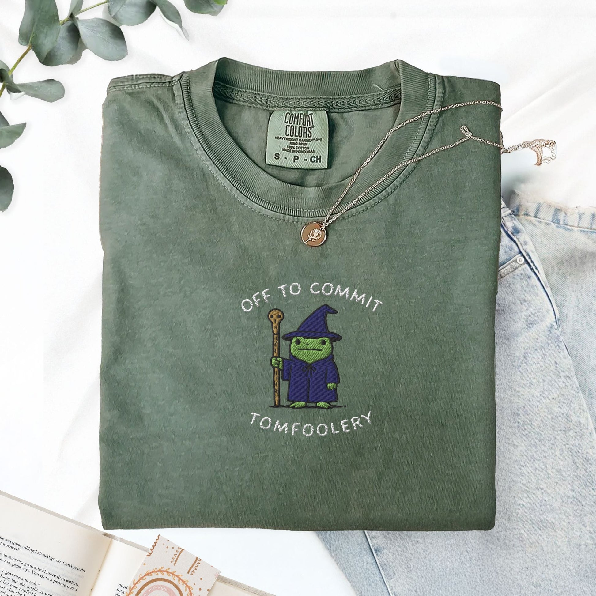 Pine Spice Books Off To Commit Tomfoolery Embroidered Frog T-Shirt Off To Commit Tomfoolery Embroidered Frog T-Shirt