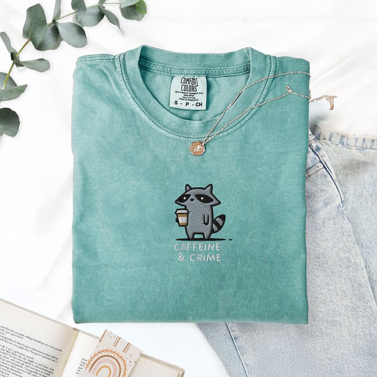 Pine Spice Books Caffeine And Crime Embroidered Raccoon T-Shirt Caffeine And Crime Embroidered Raccoon T-Shirt
