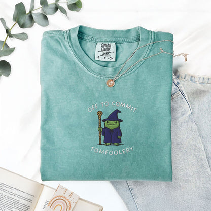 Pine Spice Books Off To Commit Tomfoolery Embroidered Frog T-Shirt Off To Commit Tomfoolery Embroidered Frog T-Shirt
