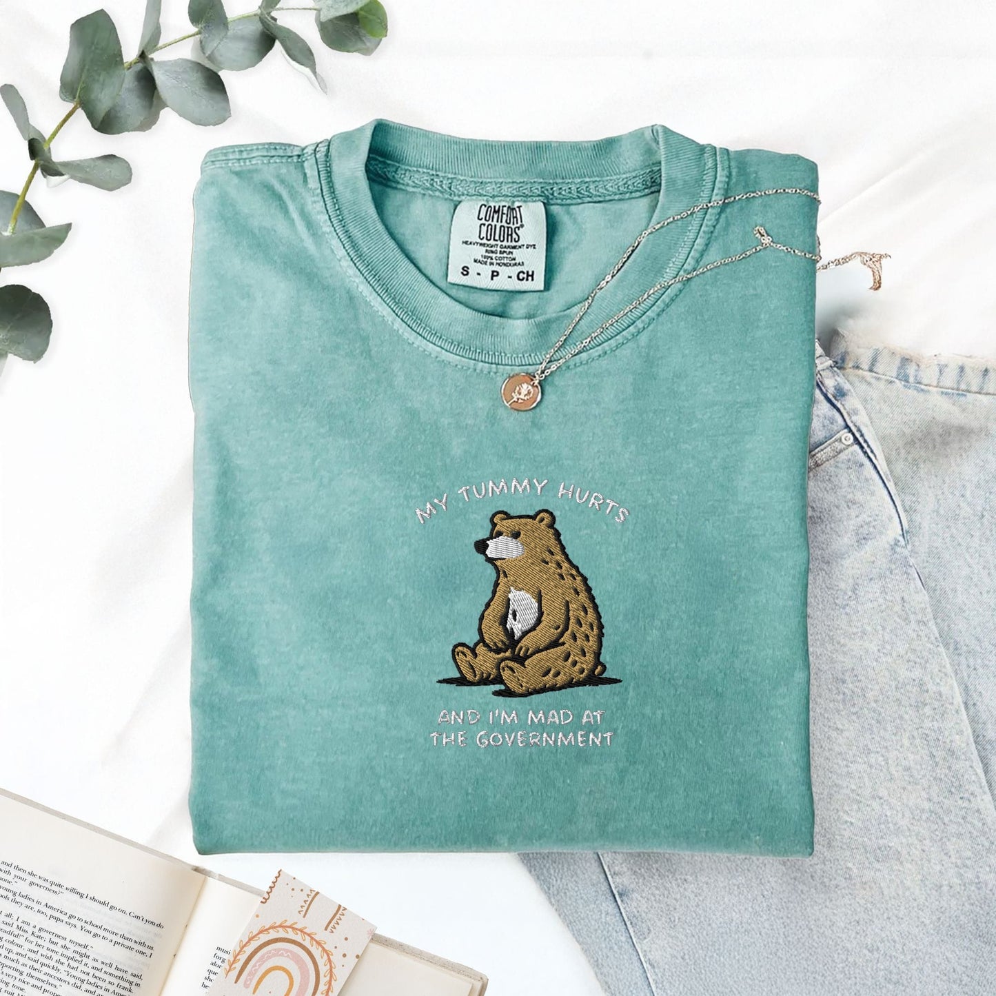 Pine Spice Books Tummy Hurts Embroidered T-Shirt Tummy Hurts Embroidered T-Shirt