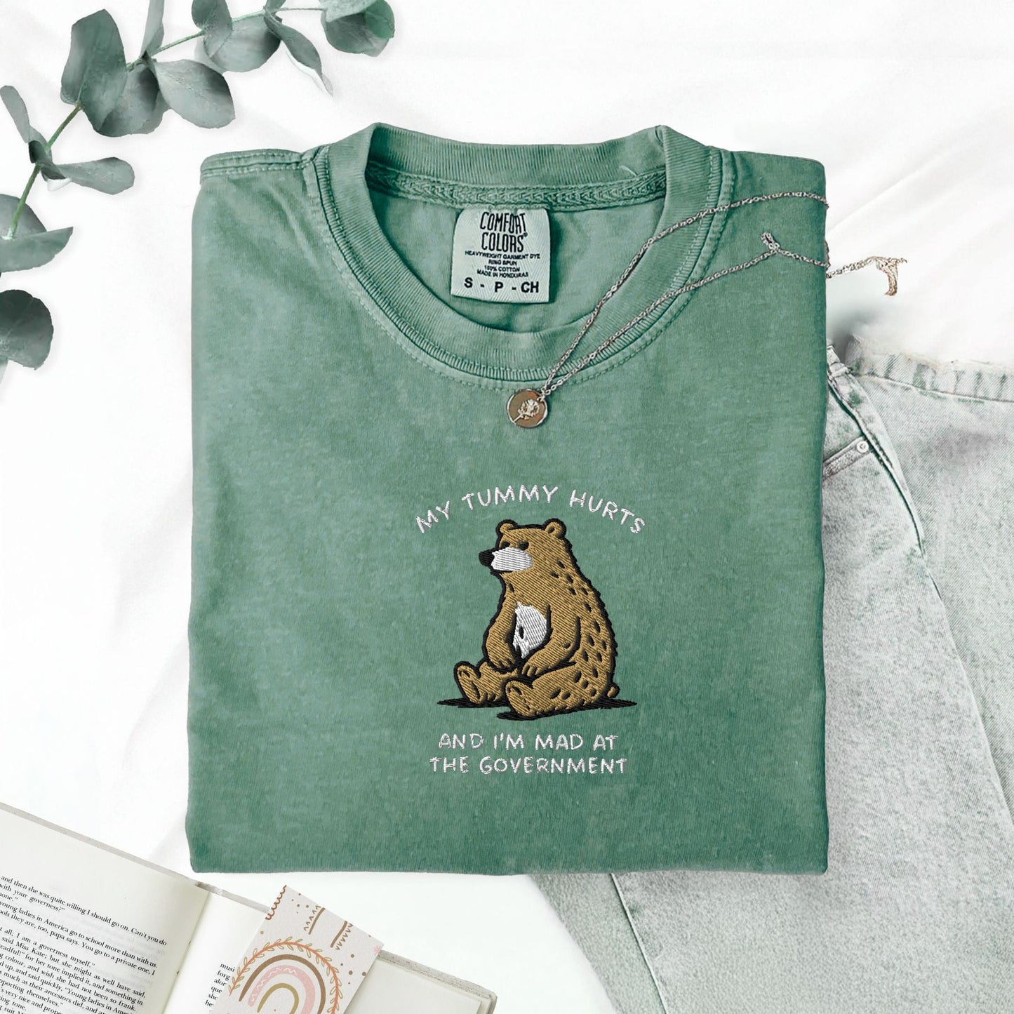 Pine Spice Books Tummy Hurts Embroidered T-Shirt Tummy Hurts Embroidered T-Shirt