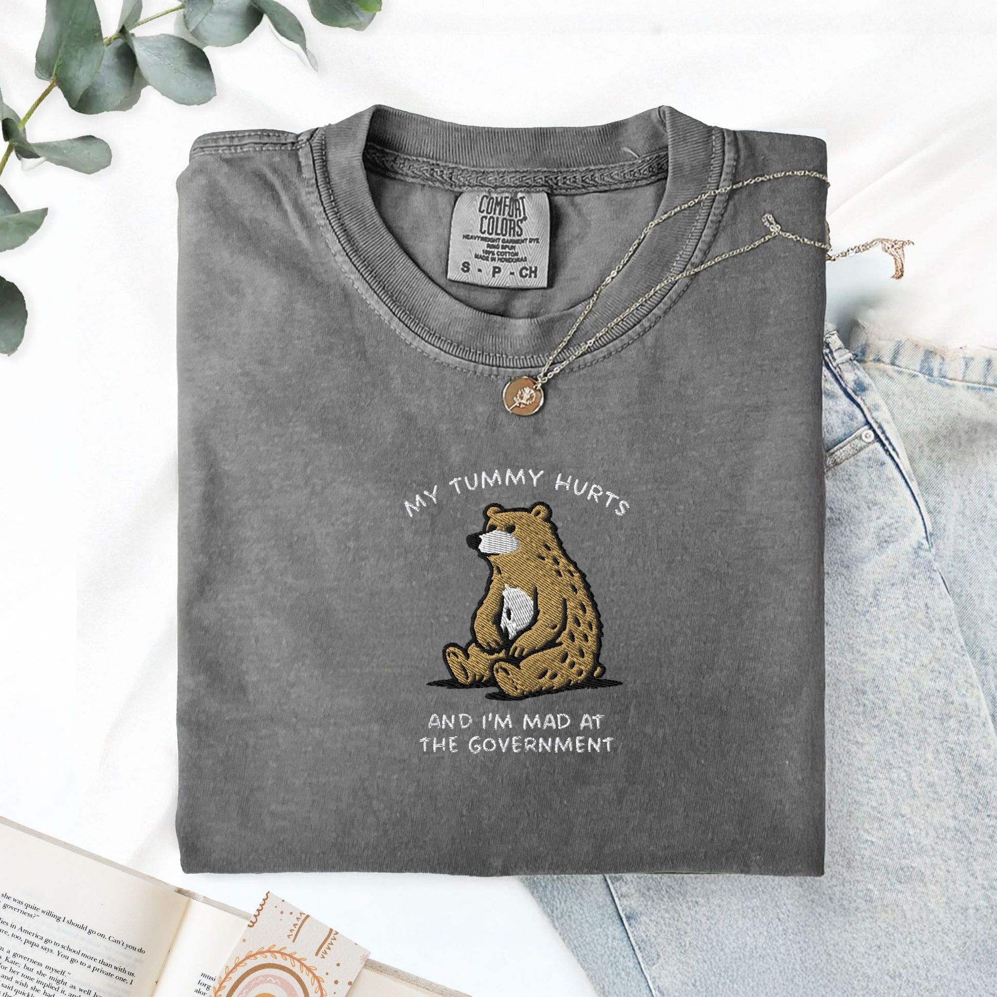 Pine Spice Books Tummy Hurts Embroidered T-Shirt Tummy Hurts Embroidered T-Shirt