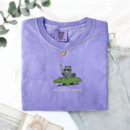Pine Spice Books We Ride At Dawn Raccoon And Alligator Embroidered T-Shirt We Ride At Dawn Raccoon And Alligator Embroidered T-Shirt