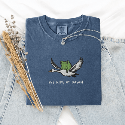 Pine Spice Books We Ride At Dawn Frog Goose Embroidered T-Shirt We Ride At Dawn Frog Goose Embroidered T-Shirt